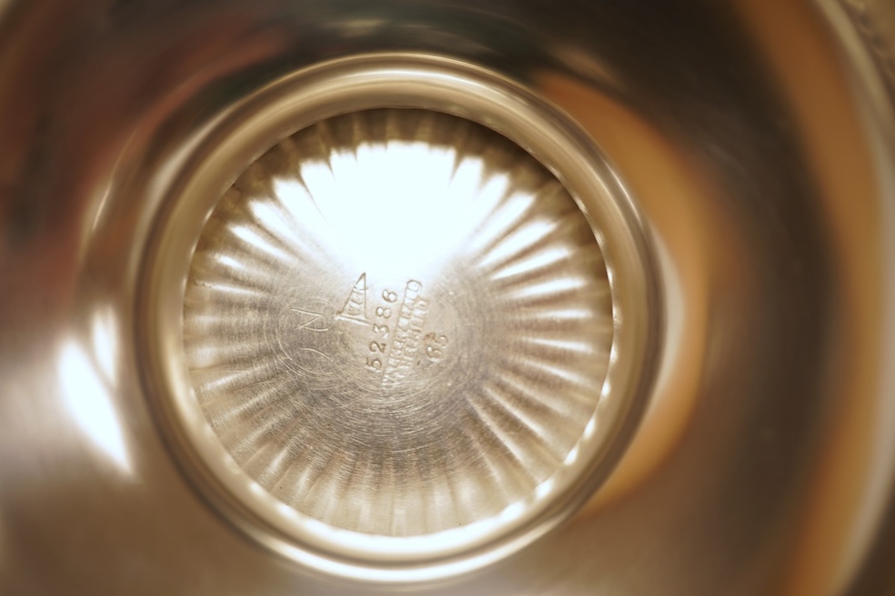 A George VI demi-fluted silver rose bowl, by Walker & Hall, Sheffield, 1939, diameter 14.4cm, 7.2oz, on an ebonised socle.